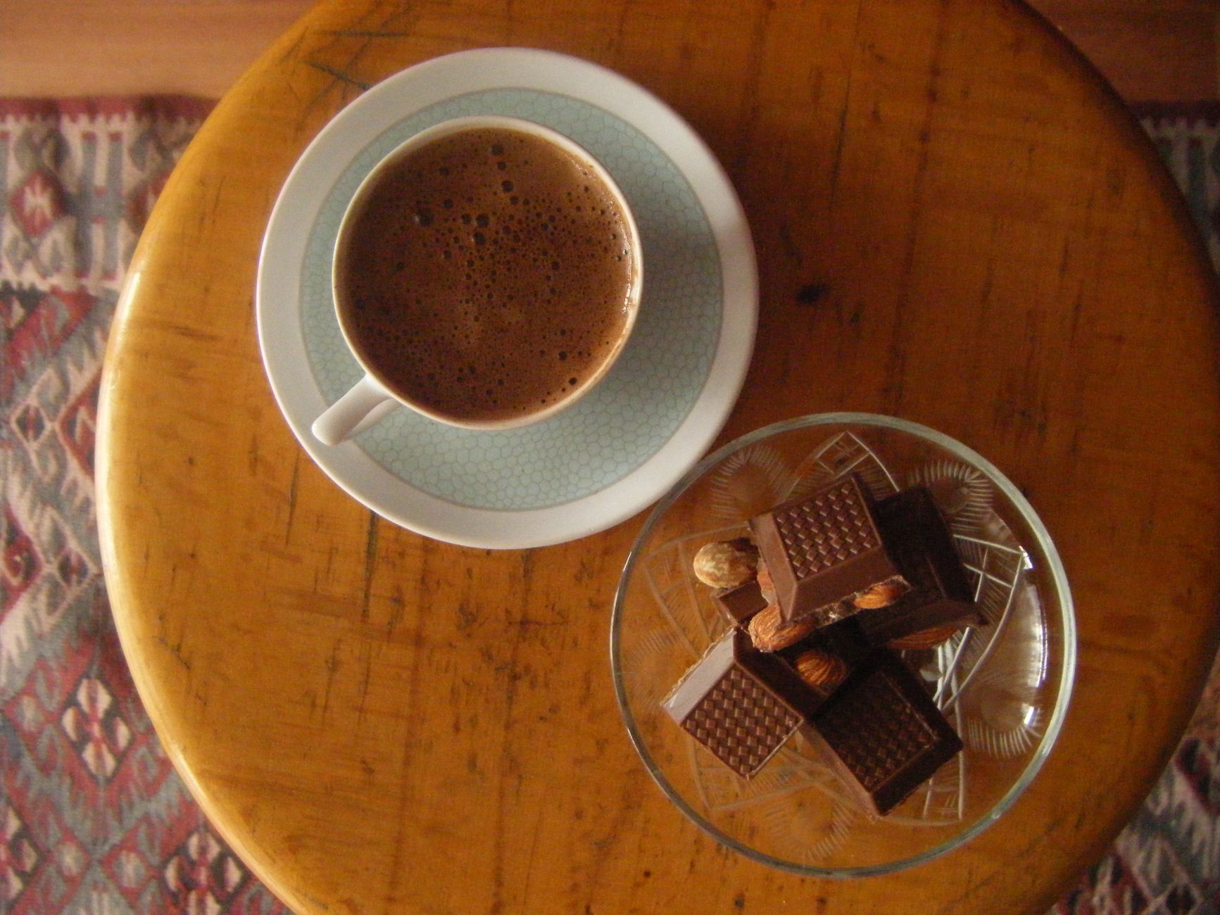 cozy coffee and chocolate pairing on rustic table